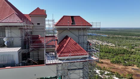 Point-of-interest-view-of-scaffold-on-a-high-rise-with-a-damaged-roof