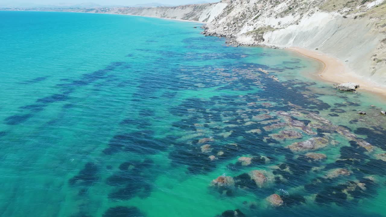 Aerial drone footage of Punta Bianca, Sicily: white limestone cliffs, turquoise sea, and untouched coastline. Perfect for travel, nature, and cinematic landscape projects