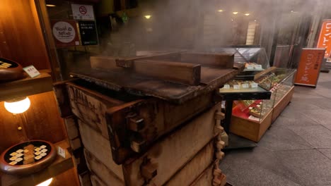 smoke billows from sushi rice cooker outdoors