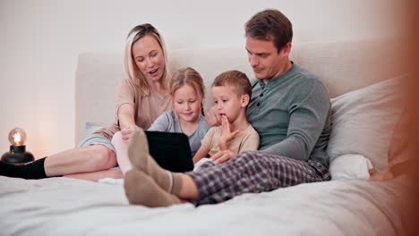Parents,-children-and-tablet-in-bedroom-for-games