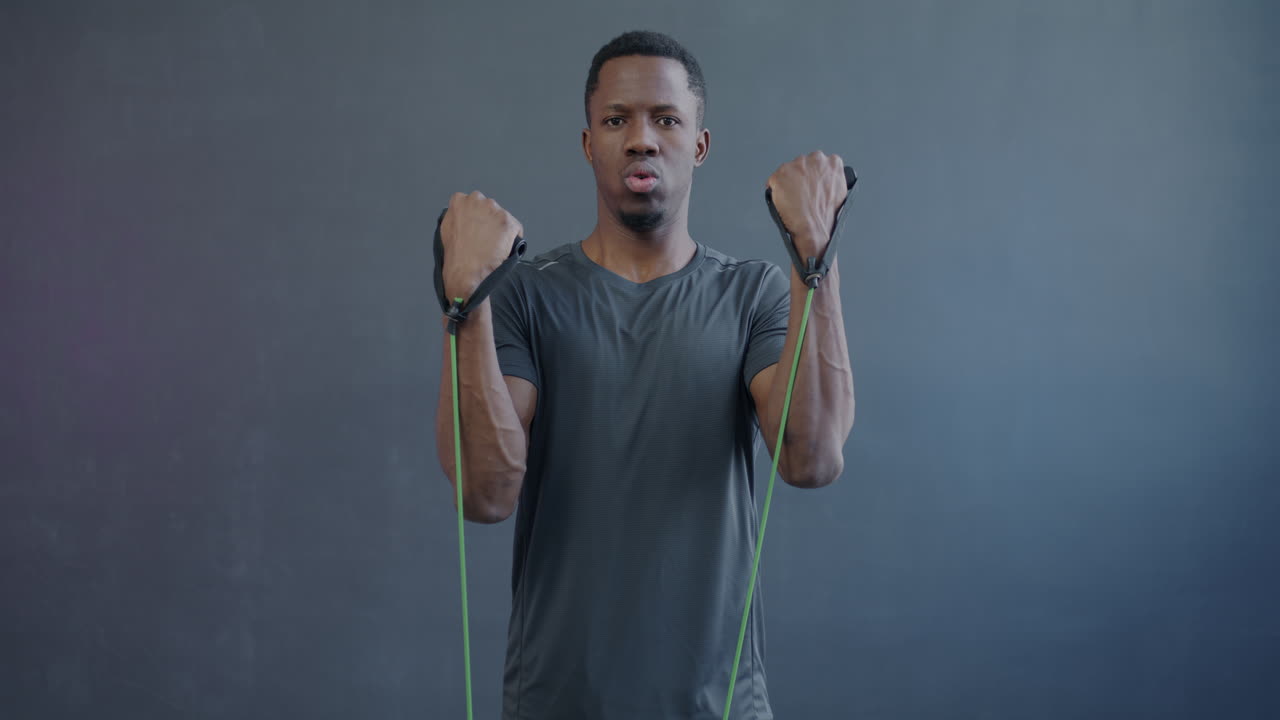 Man exercising with resistance bands