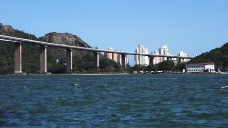 side-view-of-the-imposing-Third-bridge,-or-Terceira-ponte,-with-its-columns