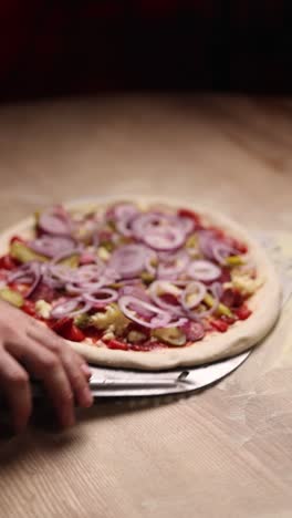 chef preparing a pizza