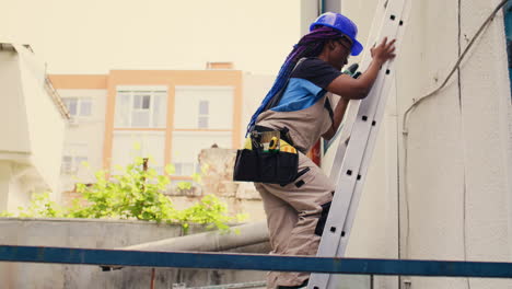 mechanic climbing folding ladder