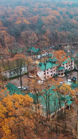 luxury hotel aerial shot. complex buildings surrounded by forest
