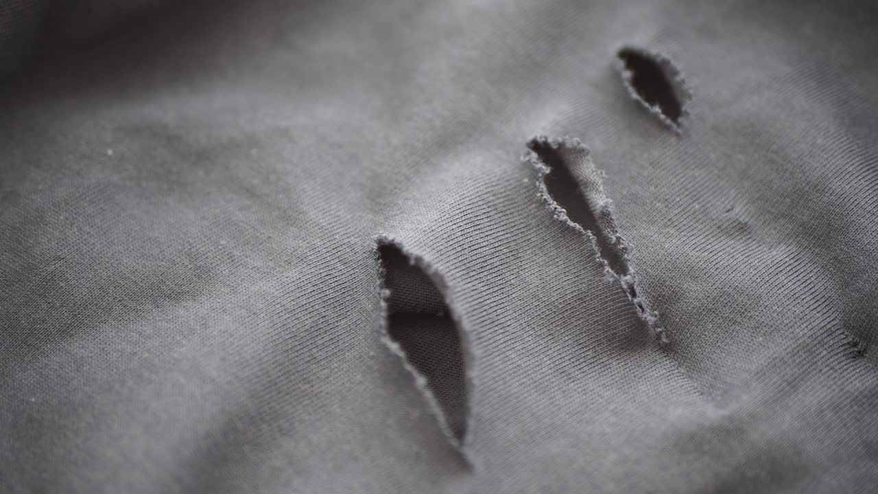 Torn Grey Fabric