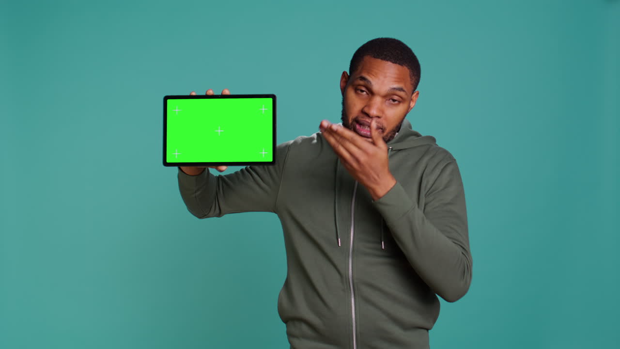 Tech content creator holding isolated screen tablet, doing advertisement