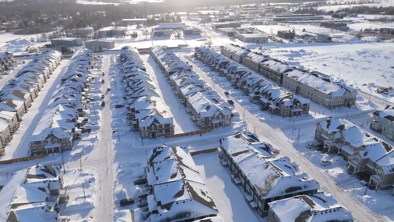 Suburban housing development with snow covered streets in Ontario Canada Aerial