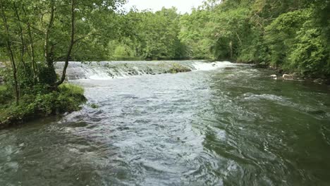 drone flying over sarthe river, toyères canyon, saint-pierre-des-nids, france