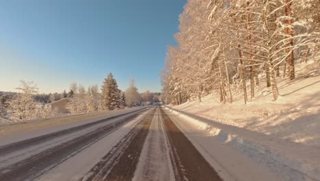 scenic winter commute on icy road pov drive through forest highway finland