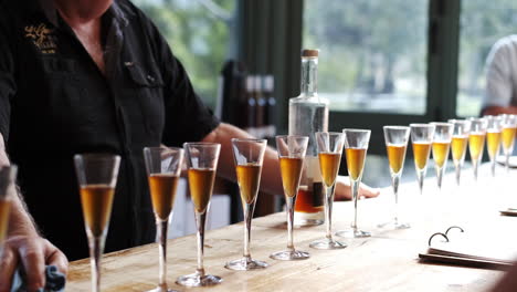 row of elegant full goblets during a wine tasting