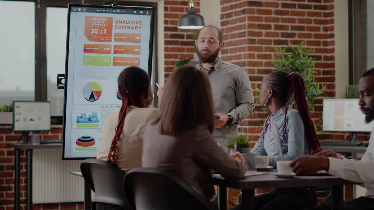 Business man discussing company growth with analysis on monitor