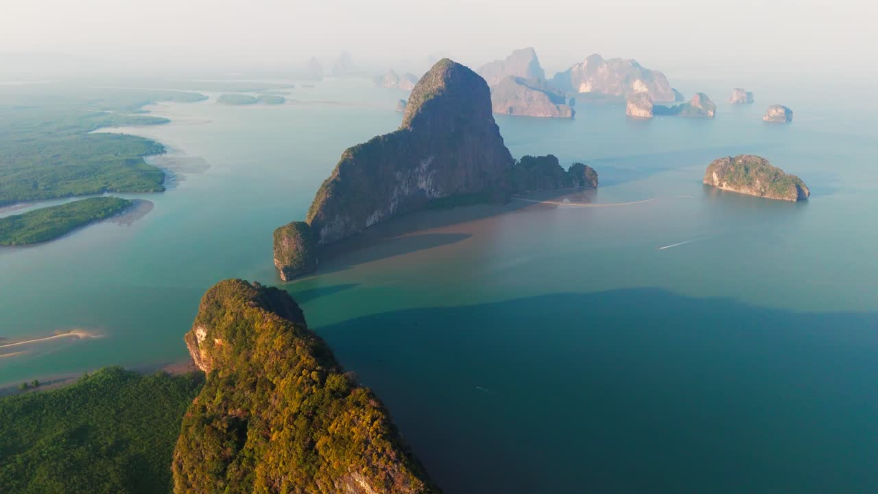 Aerial panoramic overview Phang Nga Bay, Thailand, stunning limestone karsts, turquoise waters, and islands casting long shadows on ocean
