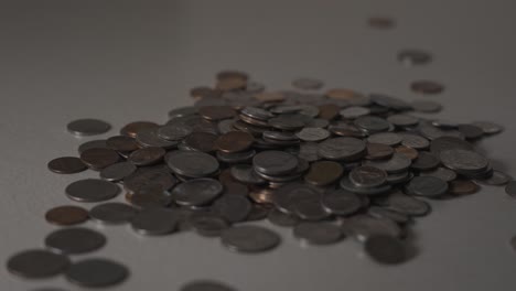 quarters, dimes, nickels, and pennies in a pile for sorting