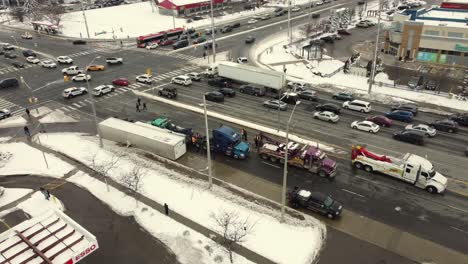 aerial, semi truck trailer flipped over on street intersection in canada