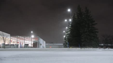 major gusts of snow blowing around in industrial canadian roadway