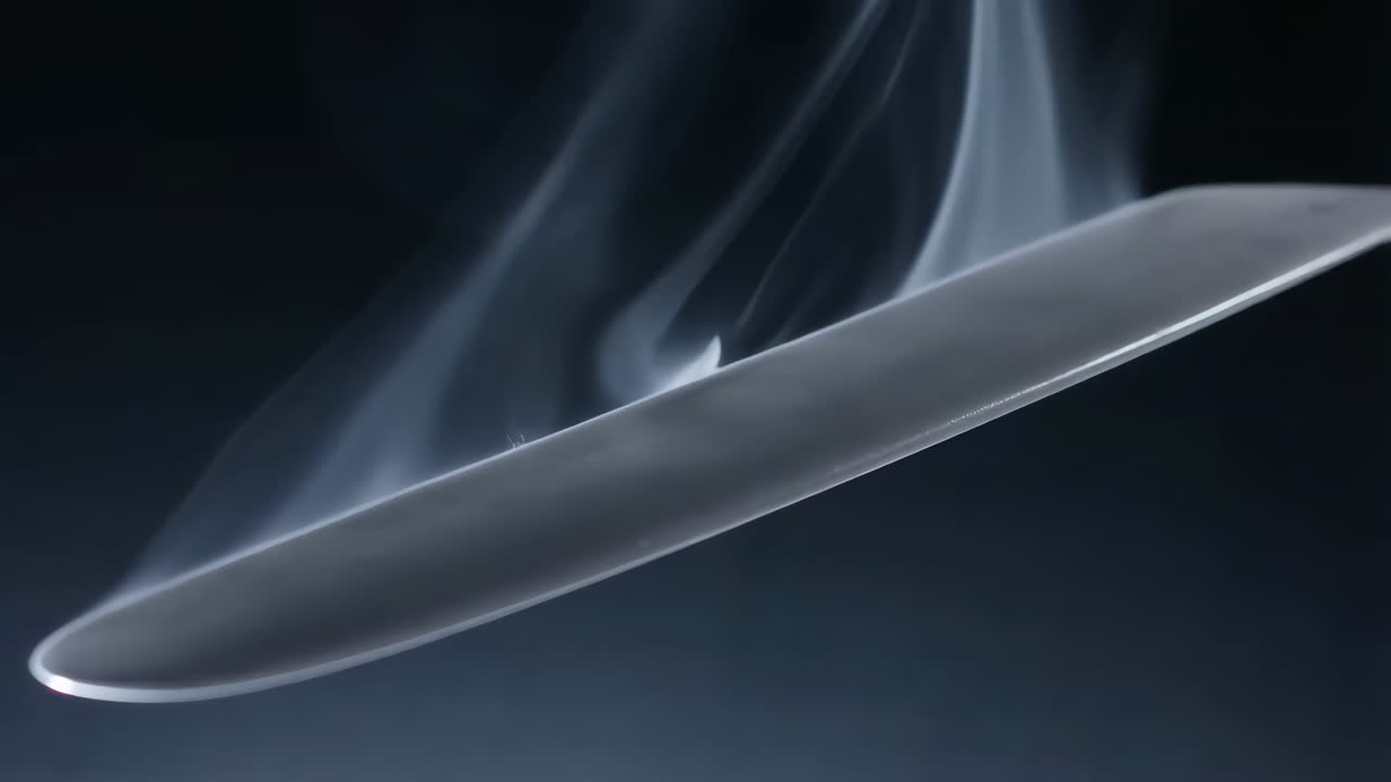 Smoke surrounding a steel blade