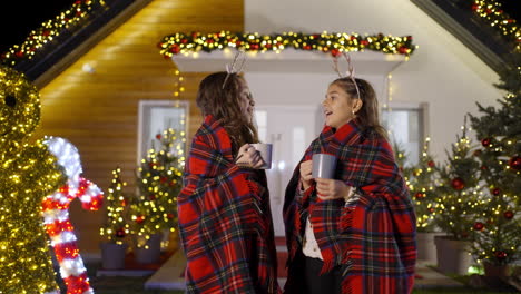girls drinking hot chocolate at christmas