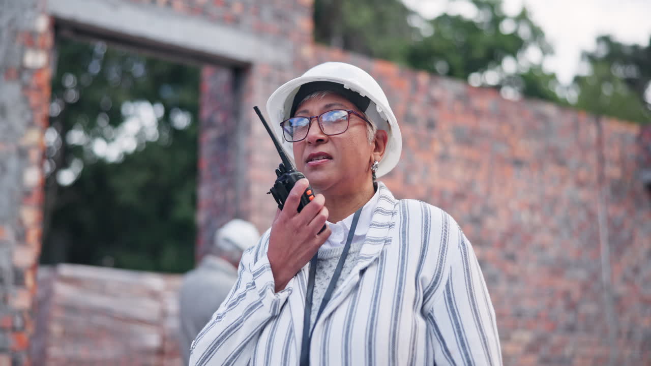 Construction worker using two way radio in a construction site