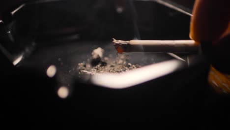 Close-up-smoking-cigarette-on-man-hand