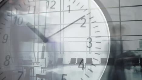 People-walking-fast-with-clock-in-the-foreground