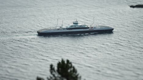 a big ferry is passing in the fjord tilt-shift video, slow-motion