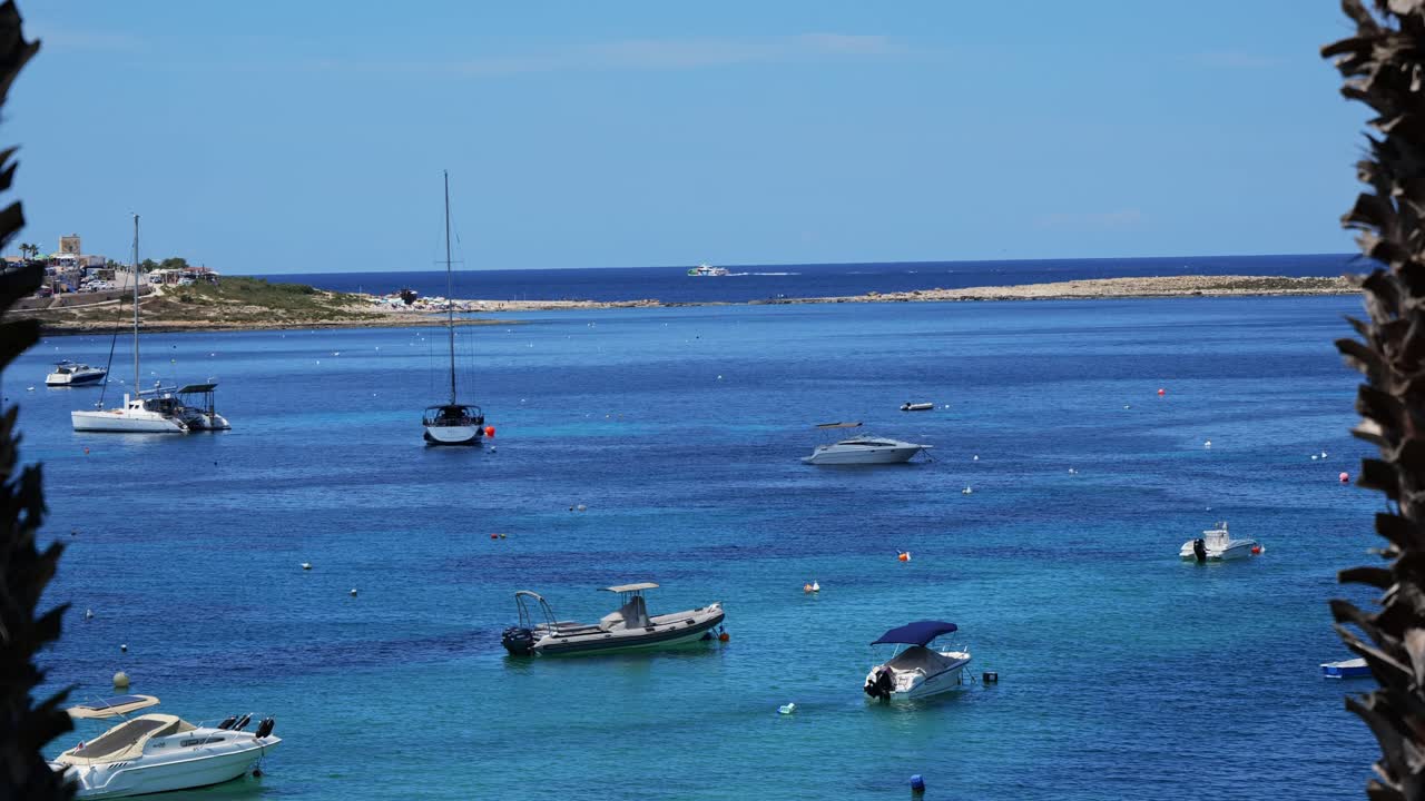 Relax to pleasure beats by a peaceful lagoon on the Mediterranean Sea, where summer shines and boats stay still.