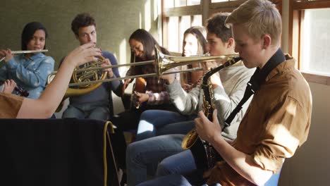 teenage musicians rehearsing