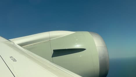 engine of airplane turning right in the sky