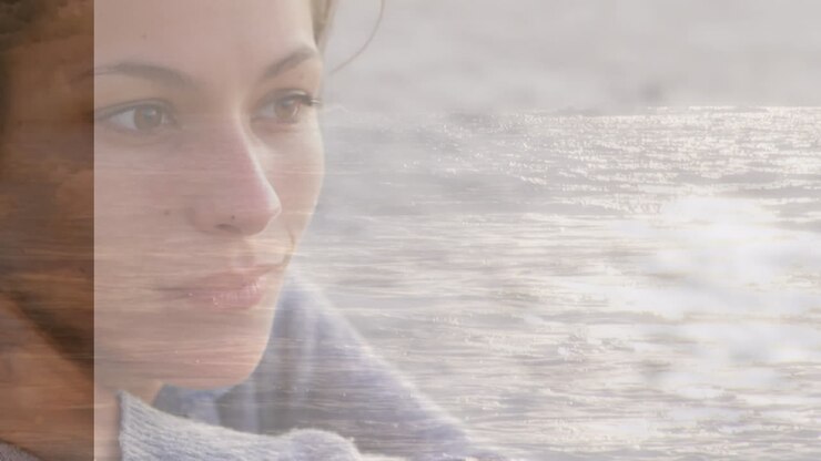 Animation of caucasian woman at beach over sea