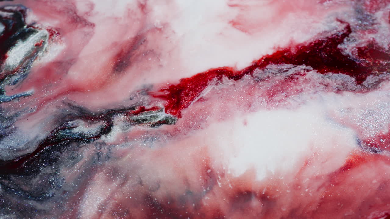 Marbled background formed by dense ink in motion. Macro view
