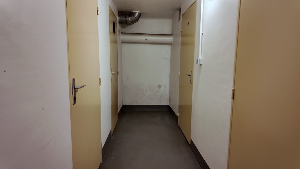 POV of A Person Walking Oh The Hallway Along The Doors