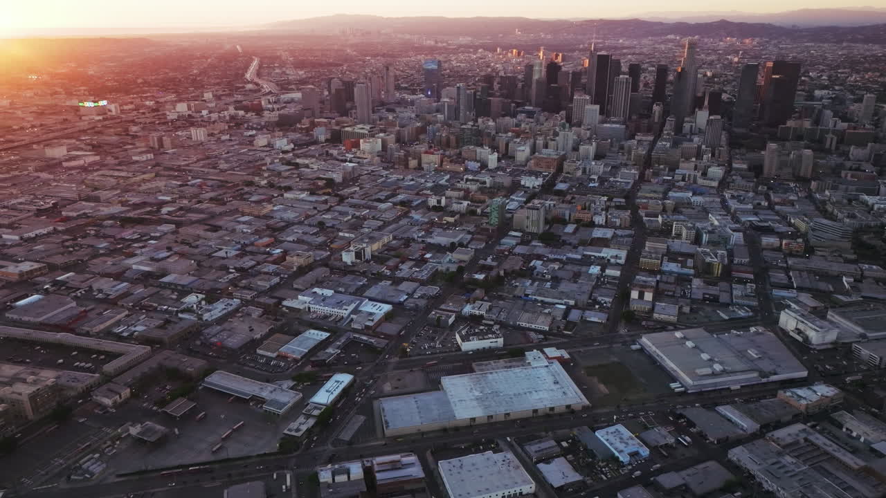 Aerial View of a Sprawling City Skyline at Sunset