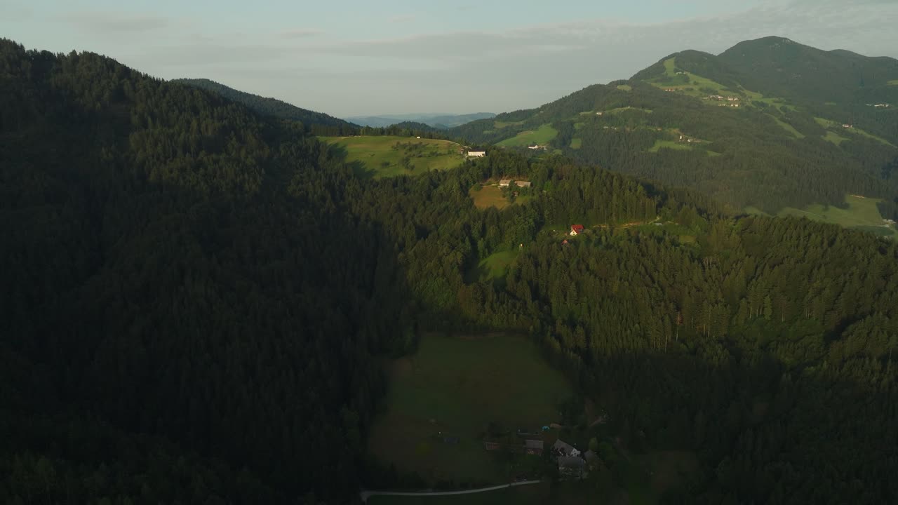 Aerial View of Mountainous Landscape with Houses and Fields