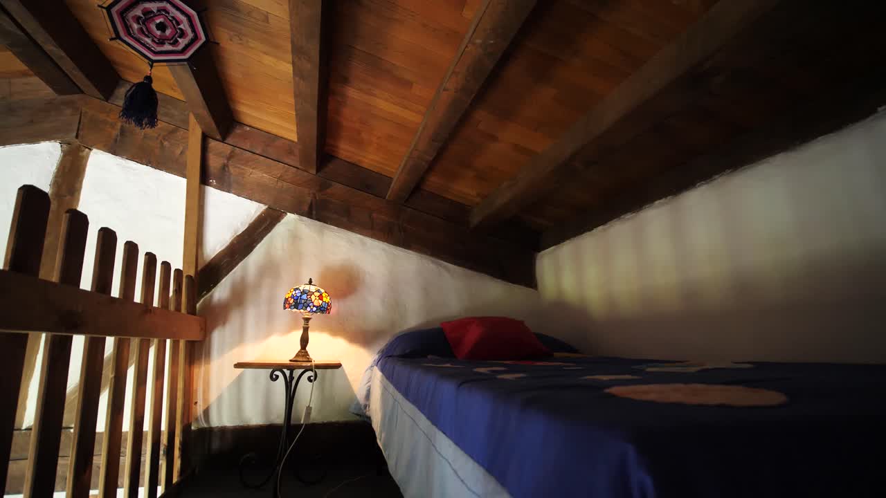 Small bedroom in a wooden tiny house and cozy and warm feeling