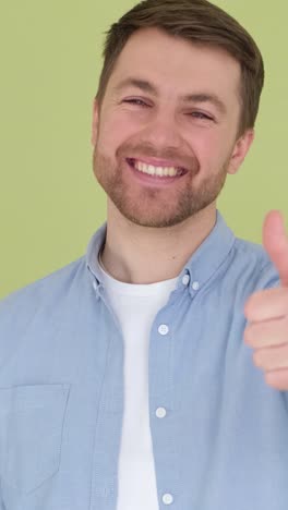 portrait caucasian teenager guy showing thumb up like gesture good exams result successful study in portrait caucasian teenager guy showing thumb up like gesture good exams result successful study in school college library teen boy happy smiling recommend education studying learning approve hand hig