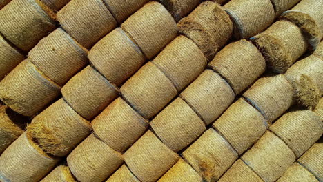 rows of hay bales in farmhouse