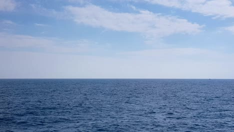 view of the ocean and clouds in the sky. blue sky with clouds in sunny weather over the ocean.