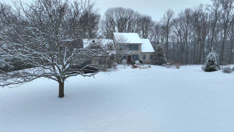 aerial establishing shot of american house in winter