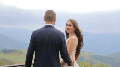 happy bride and groom kissing in a beautiful outdoor wedding setting a joyful bride and groom kissing in a sunlit field sharing smiles and laughter as they celebrate their special day in a picturesque outdoor setting surrounded by nature