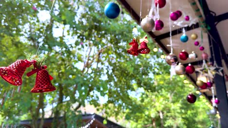 decorative bells and ornaments sway in breeze