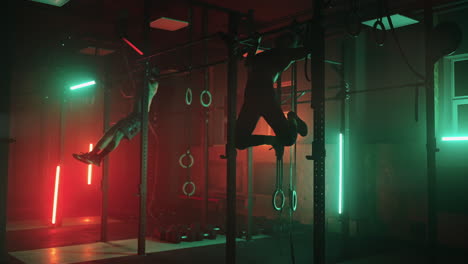 two men and a woman in the gym do pull-ups on the horizontal bar together in a dark neon light. atmosphere of fitness and training