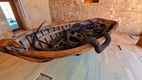 snakes and a boat artwork at venetian fortezza castle (fortezza of rethymno) in crete, greece. closeup shot