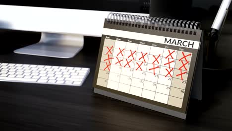 cruzando los días en el calendario del año de la mesa. contando los días acelerando, volviendo páginas. llegando a los objetivos.