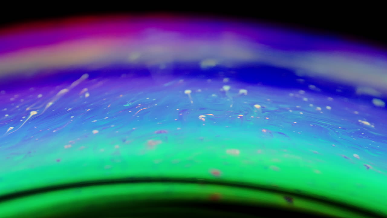 abstract fluid art captured in a macro soap bubble