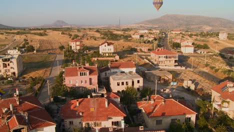 hot air balloons fly over a neighborhood near cappadocia turkey 1