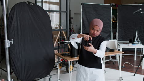 photographer taking pictures in studio