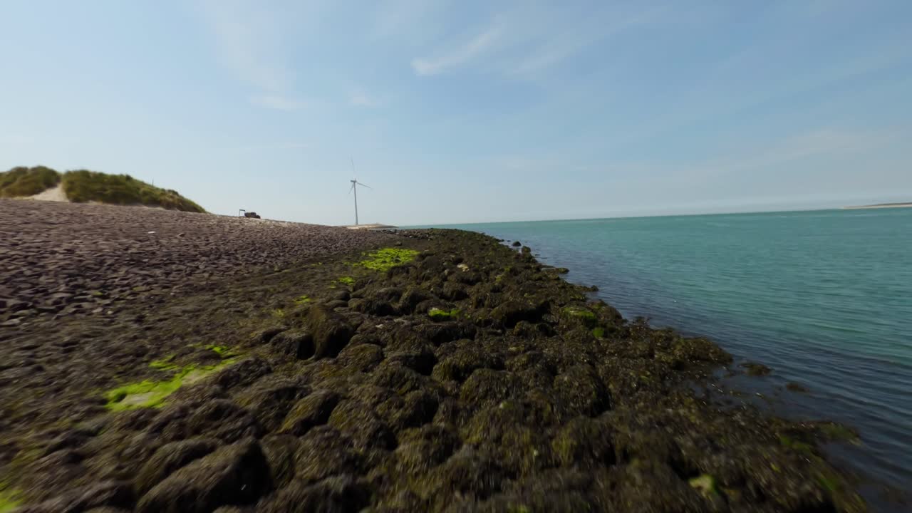 Drone shot of the seashore of the beautiful artificial island of Neeltje Jans in Zeeland,Holland