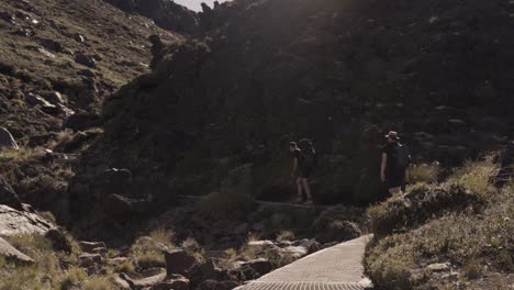 backpackers on the trail of tongariro alpine crossing in new zealand