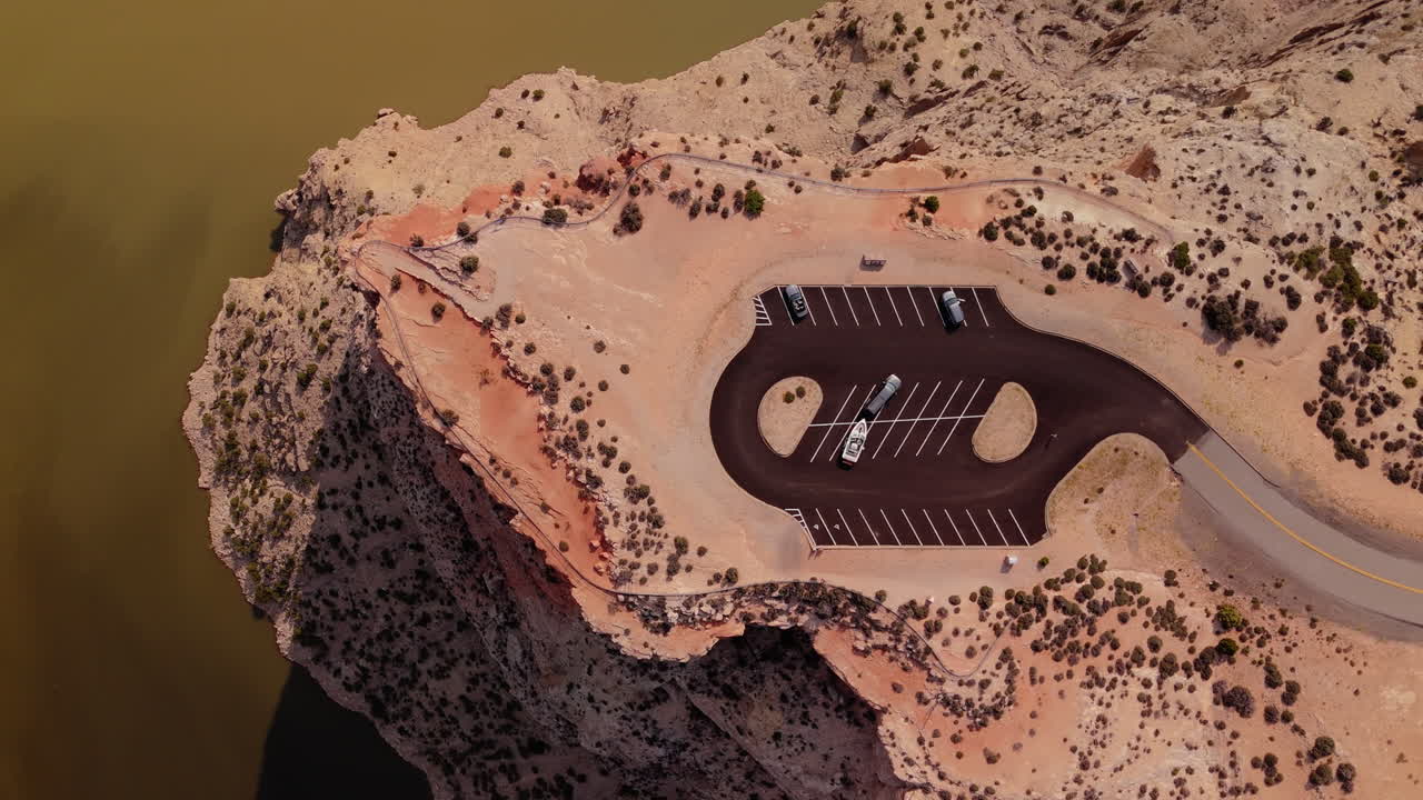 Aerial View of Scenic Cliffside Parking Area by a Lake